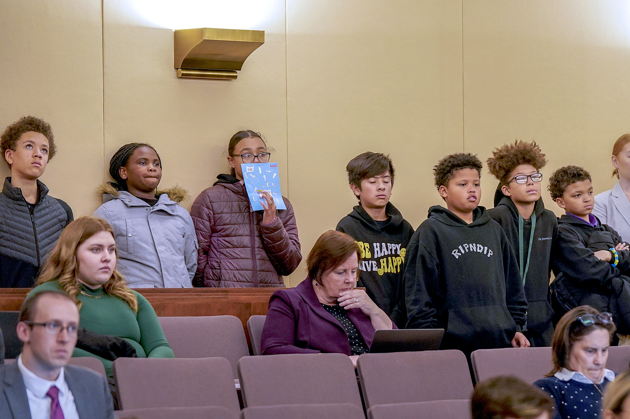 Fifth and sixth grade students from The Journey School in St. Paul visit the House Education Finance Committee meeting April 17. The students were participating in Minnesota Literacy Day at the Capitol. (Photo by Michele Jokinen)